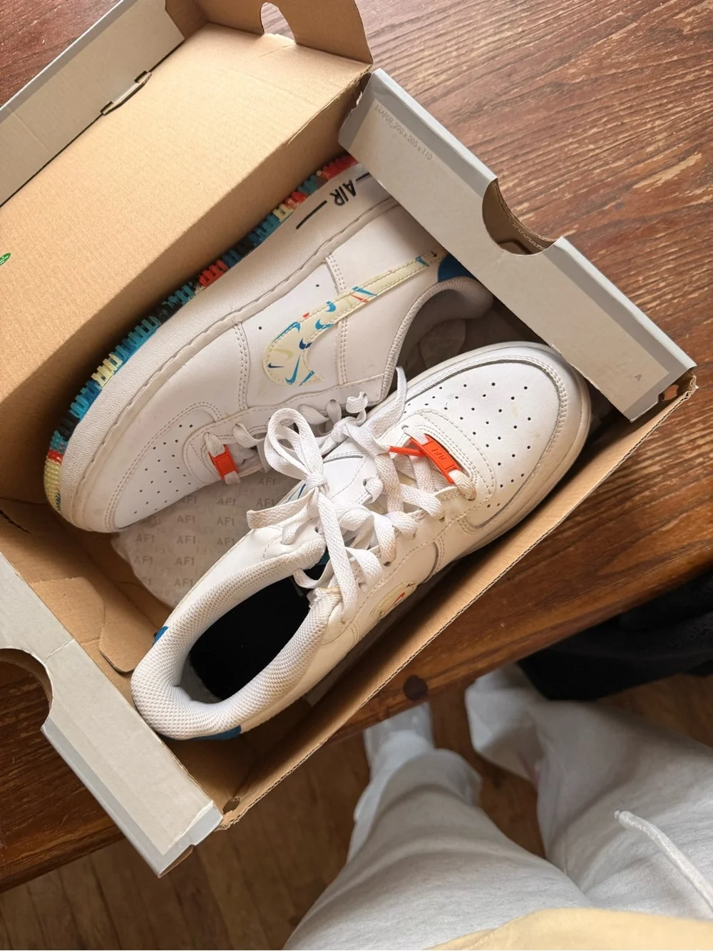 White Nike Low-Top Sneakers with Multicolor Accent